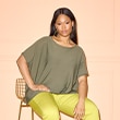 The model wears a green shirt