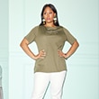 The model wears a green t-shirt