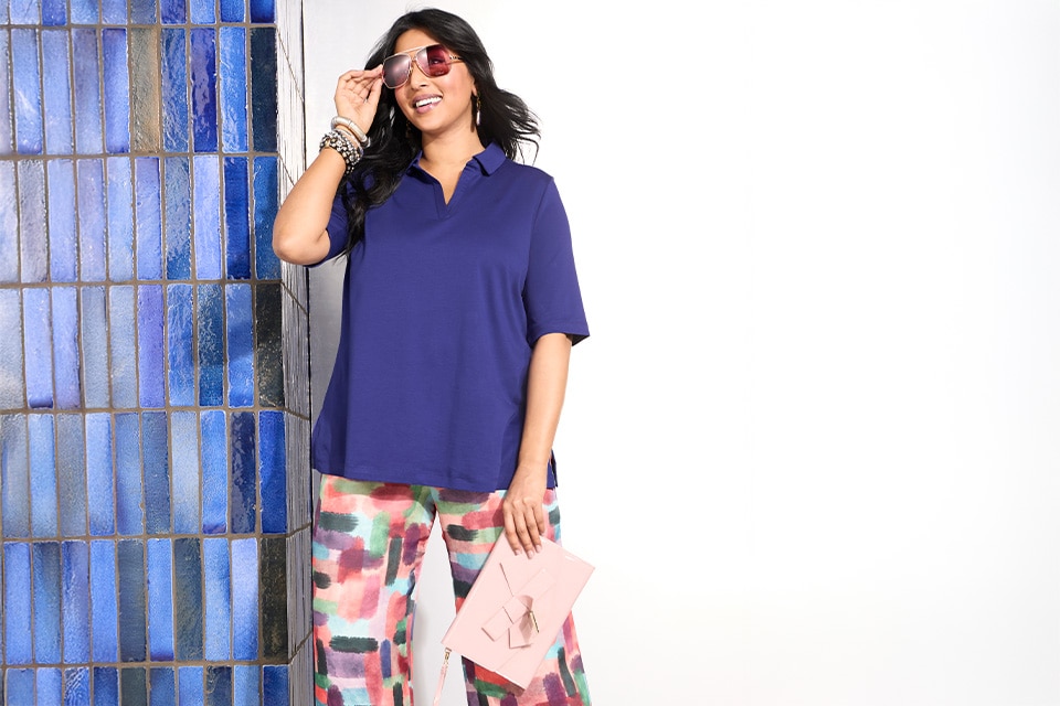 The model is wearing a blue shirt