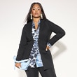 The model wears a black blazer
