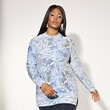 The model is wearing a colorful blouse