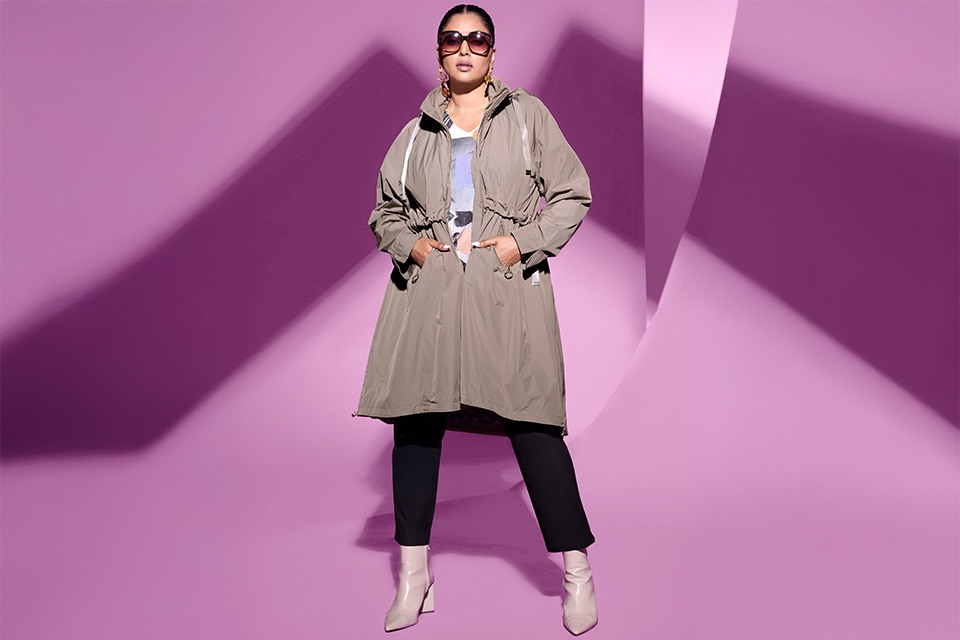 The model wears a coat