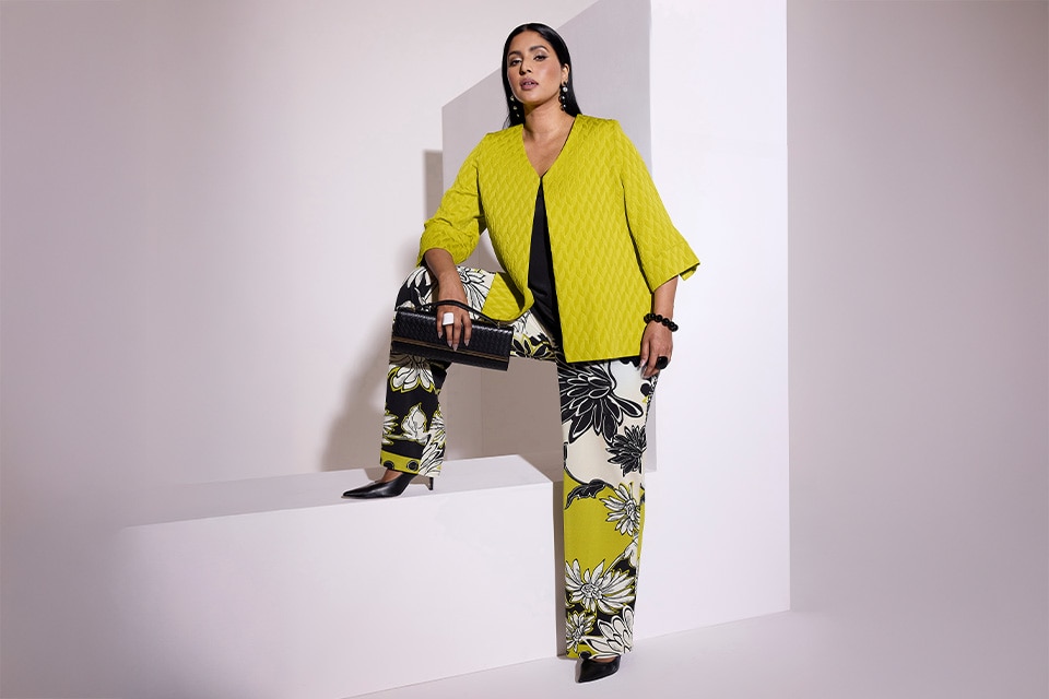 The model wears a floral blouse