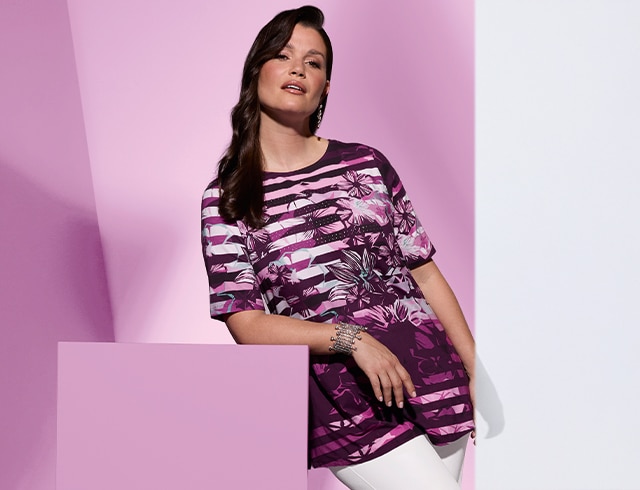 The model is wearing a colorful shirt