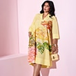 The model is wearing a yellow floral dress