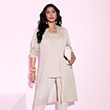 The model wears a beige cardigan
