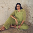 The model wears a lime green matching set.