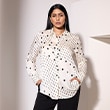 The model is wearing a white blouse.