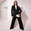 The model wears a black matching set.