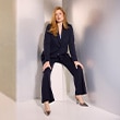 The model wears a blue matching set.