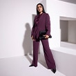 The model wears a blue matching set.