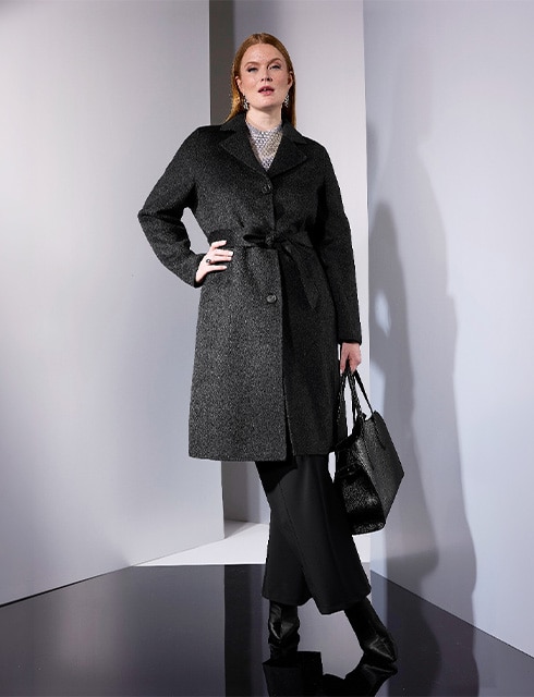 The model is wearing a coat.