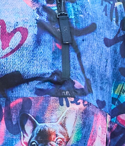 Woman wearing a blue jacket and leaning against the wall