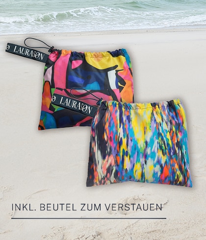 Model sits in a blue car wearing a flowered dress