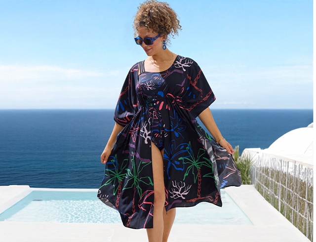 The model wears a beach dress

