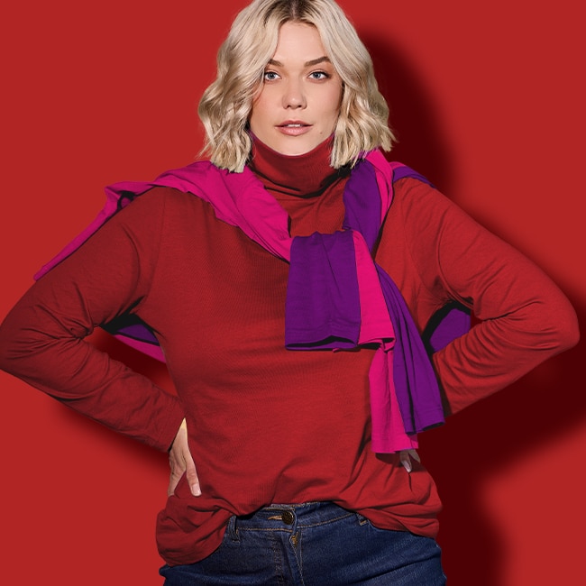 The model is wearing a red sweater