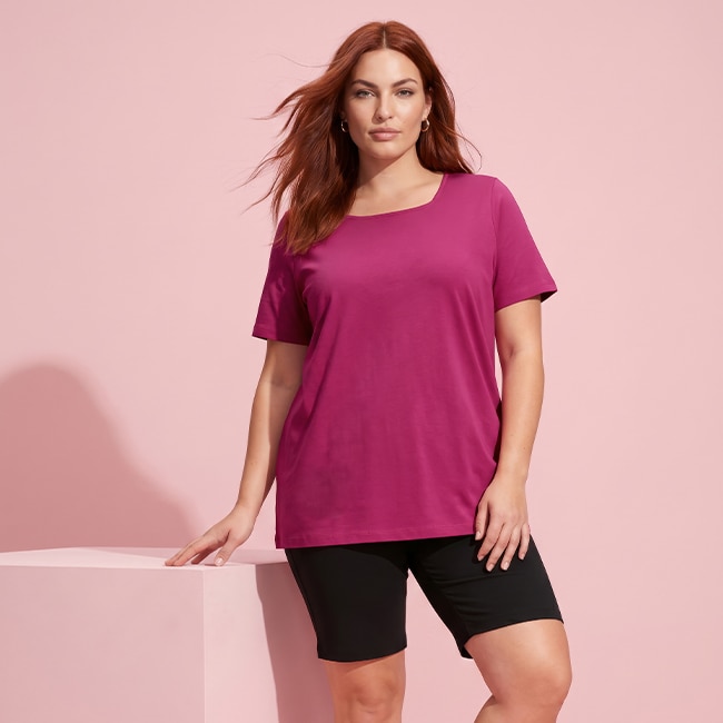 Model wearing a berry-colored cardigan
