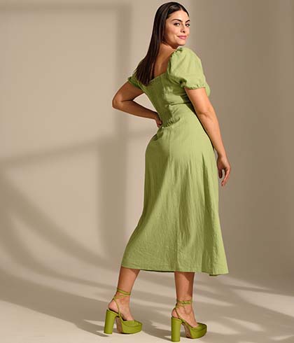 Back view of the model in a green dress 