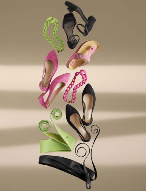 Cut from the back view of a model, with the imprint 'Black' and a lay-out of shoes and accessories Cut from the back view of a model, with the imprint 'Black' and a lay-out of shoes and accessories