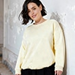 The model is wearing a yellow sweater