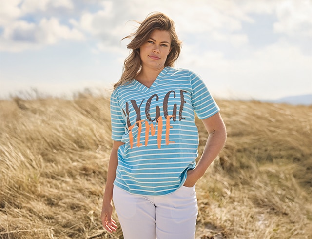 The model wears a stripped shirt