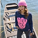 The model is wearing a quilted coat with a pattern