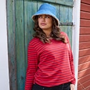 The model is wearing a quilted coat with a pattern