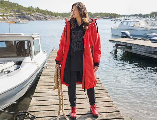 The model wears a blue dress