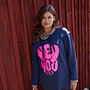 The model is wearing a colourful sweatshirt