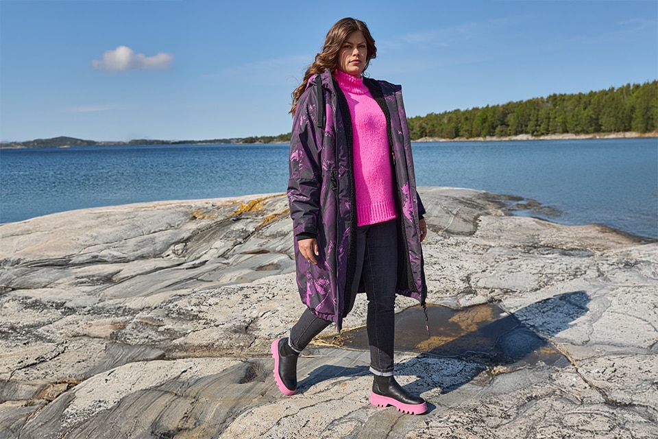 The model poses in a blouse