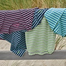 The model is wearing a quilted coat with a pattern