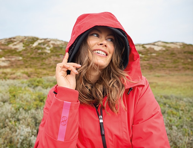 The model wears a blue dress