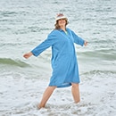 The model wears a blue dress