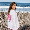 The model is wearing a red cardigan.