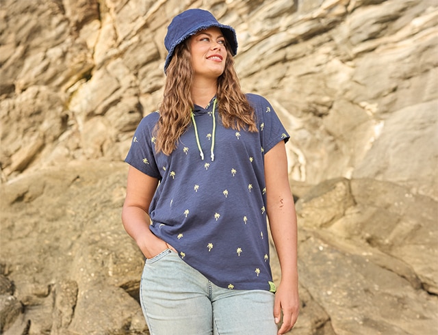 The model wears a blue shirt