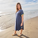 The model wears a blue dress