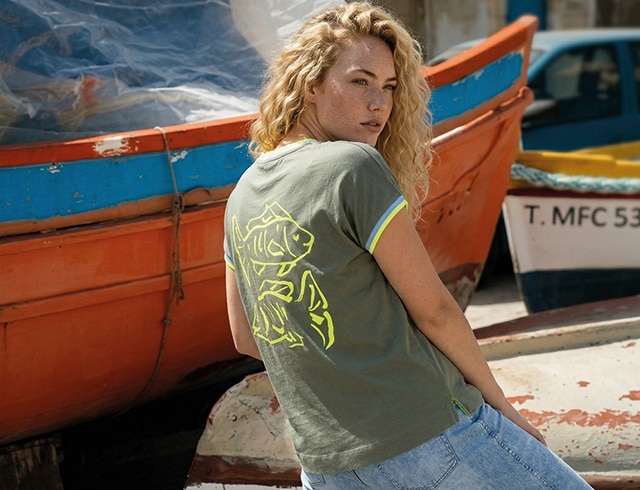 The model wears a colorful shirt