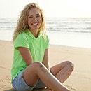 The model is wearing a red cardigan.