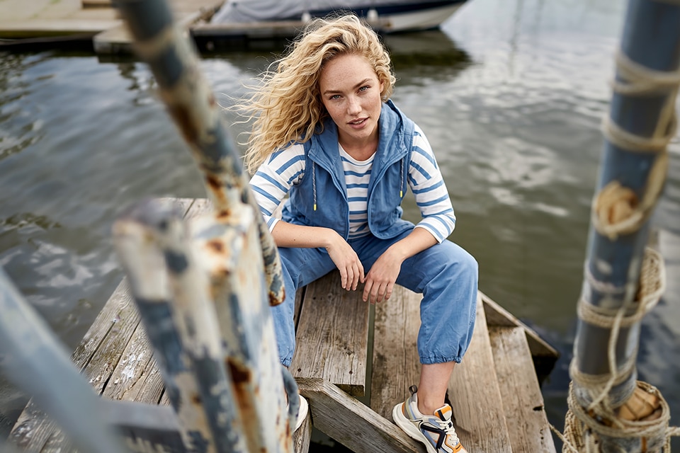 The model is wearing a shirt and a pants