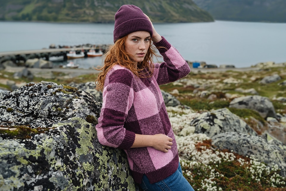 The model is wearing a pullover