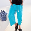 The model is wearing blue pants