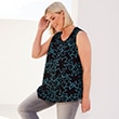 The model is wearing a dark top with a pattern