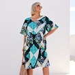 The model wears a colorful dress