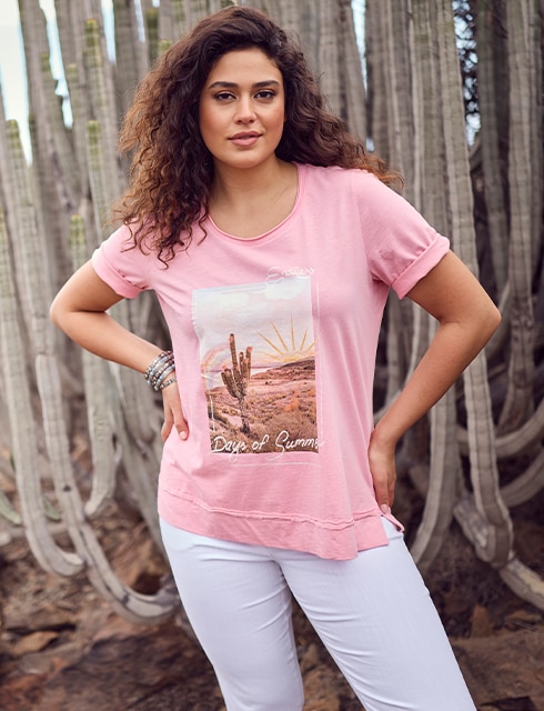 The model is wearing a pink shirt with a print