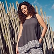 The model wears a grey top