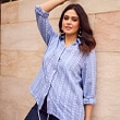 The model wears a blouse