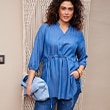 The model wears a blouse