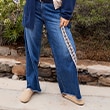 The model wears jeans