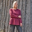 The model wears a red shirt