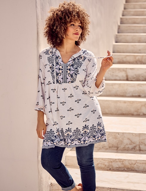 The model is wearing a blouse